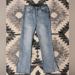 Risen straight leg jeans with side hem split